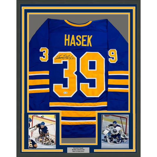 Framed Autographed/Signed Dominik Hasek 35x39 Buffalo Blue Hockey Jersey Beckett BAS COA