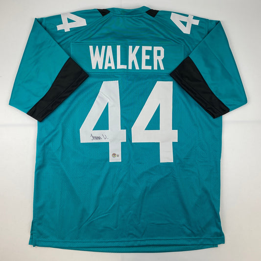 Autographed/Signed Travon Walker Jacksonville Teal Football Jersey Beckett BAS COA